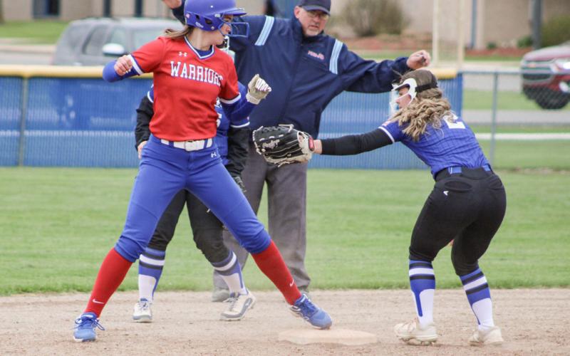 Gladwin shortstop Addison Tyslicki is a little late applying the tag at second base during Friday’s doubleheader.