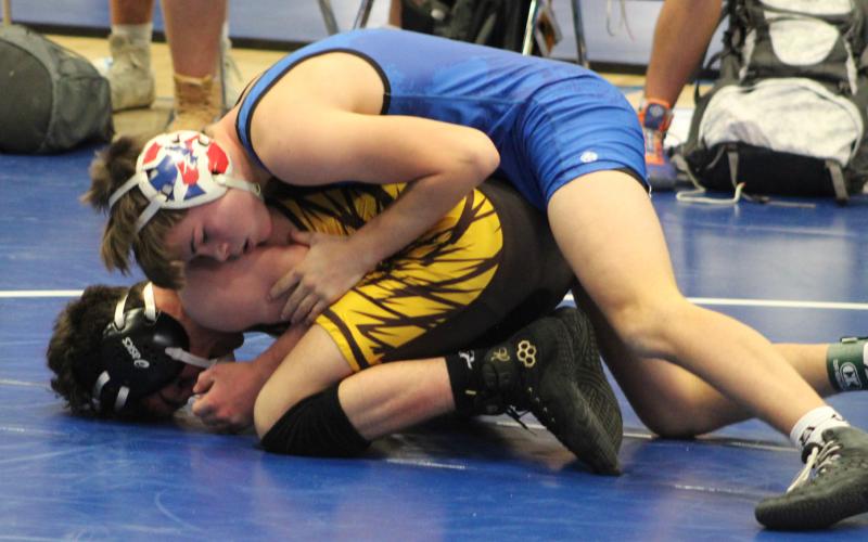 Gladwin’s Kolten Greaves battles to victory via decision at 120 during Saturday’s dual meet against Bay City Western.
