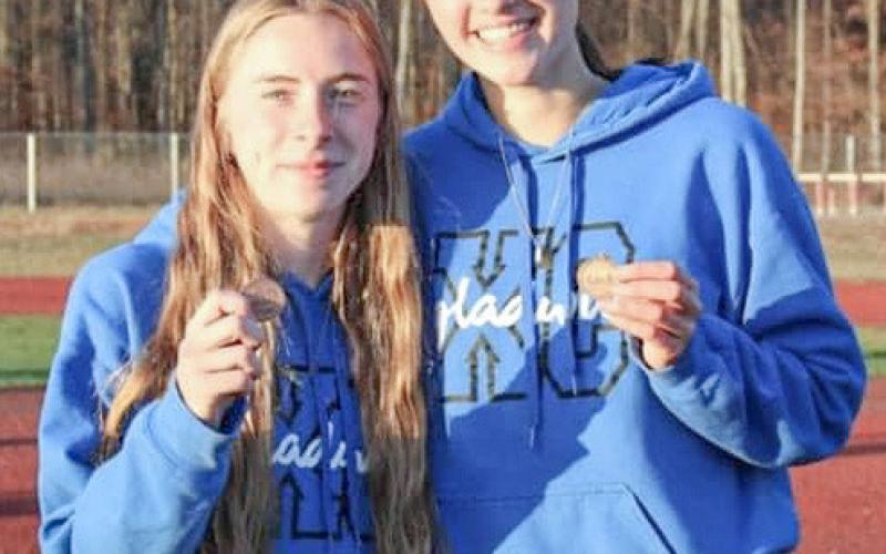 Gladwin’s Lily Binger (left) ran 11th and Abby Robinson was 13th at Friday’s regional, which earned both a trip to the state meet.