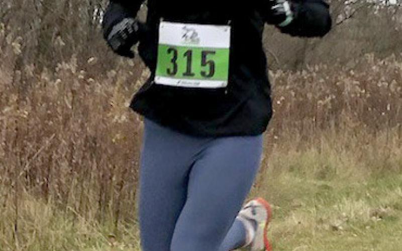 Wohlschlegel running in the Girls All Comers Open Race.