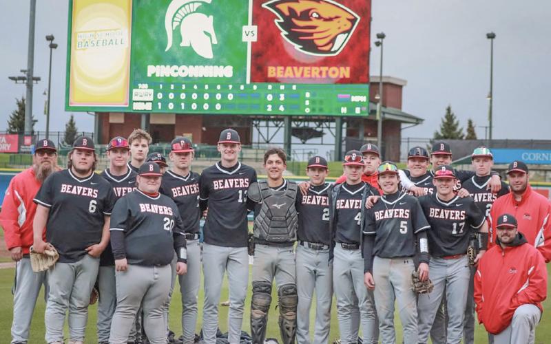 The Beaverton baseball team gathers on the field at Dow Diamond after sweeping a doubleheader with Pinconning on Thursday.
