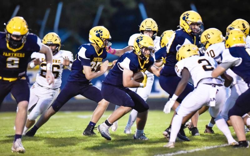 Ogemaw Heights’ Eli Smith gets ready to make a tackle in the trenches during Friday night’s victory at Standish-Sterling.