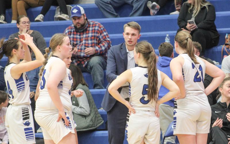 New Gladwin coach Nick Taratuta instructs the troops during a time out in the middle of Thursday’s wild double overtime loss to Shepherd.