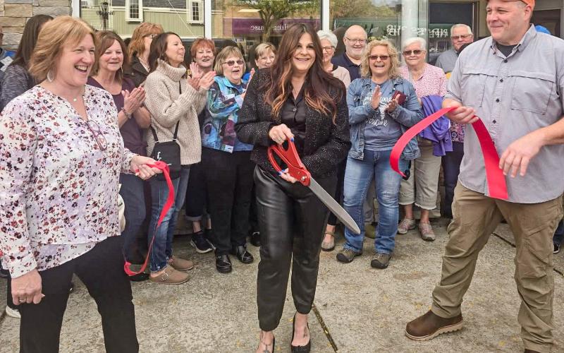 RIBBON’S CUT, NOW ABOUT THAT HAIRDO...