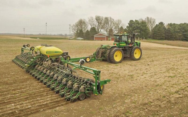 A farmer operates a soybean planter in early spring. KINGIMAGING VIA PIXABAY