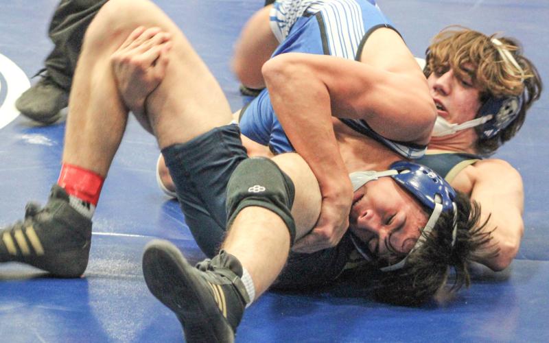 Gladwin’s Cruz Balcirak goes for a pin during a match earlier this year. Balcirak won the Jack Pine Conference championship at 126 Saturday.