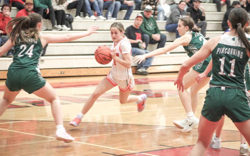 Rylan Tabaszewski splits the defense and heads toward the basket during Beaverton’s victory over Pinconning on Hall of Fame Night.