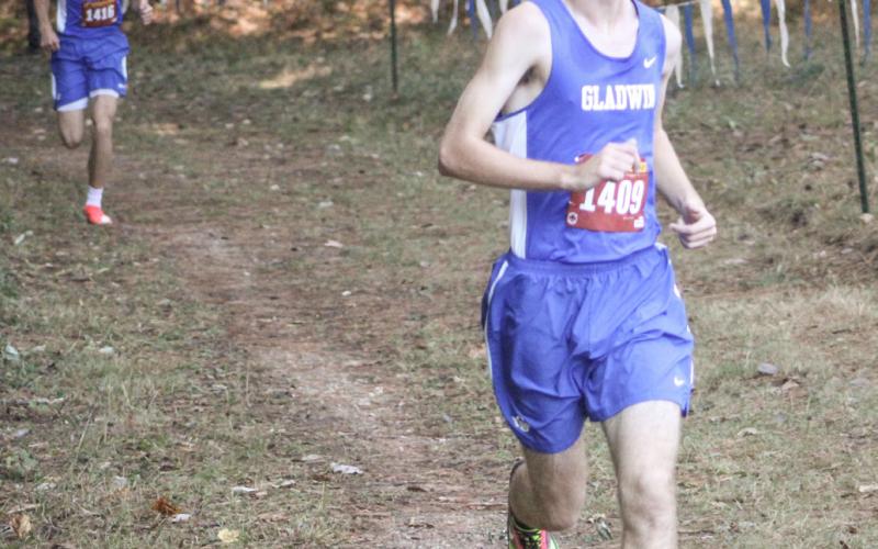 Gladwin’s Elijah Christensen rolls to the finish line first at the Cedar Bend Invitational Saturday at the Gladwin County Recreation Area.
