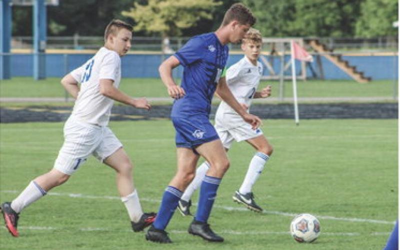Caleb Palmreuter out dribbles Northern Michigan Christian Academy players.