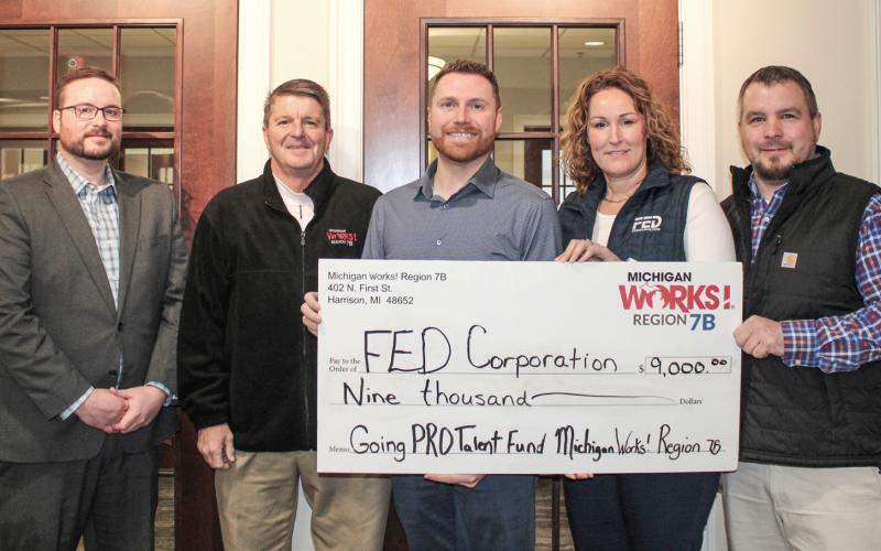 Pictured left to right are Michigan Works! Region 7B Gladwin County Director of Business Services and Economic Development Matt Lang, Michigan Works! Region 7B Executive Director Mark L. Berdan; Brock Dennings, Alisha Grove, and Scott Losey, FED Corporation.
