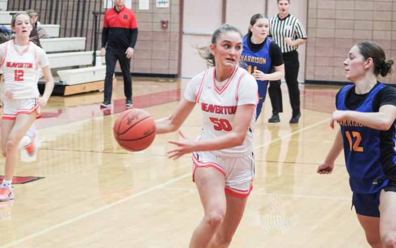 Myah Hubble eyes the basket and the defense while driving the lane during Beaverton’s win over Harrison.
