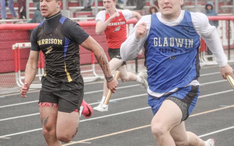 Gladwin’s Colton Pfenninger charges to the finish line at the end of the 400 relay at Wednesday’s meet at Beaverton.