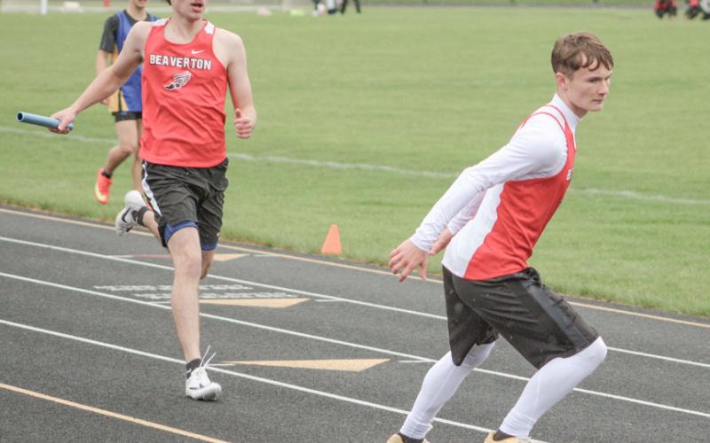 Beaverton’s Chayce Cazabon executes the handoff to Colton Miller on the way to winning the 800 meter relay at last week’s meet.