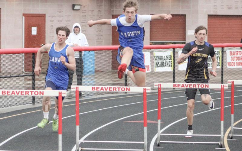 Keaton Mausolf and Alo Clements (left) compete in the 300 hurdles to help Gladwin rack up three Jack Pine Conference dual meet victories last week at Beaverton.