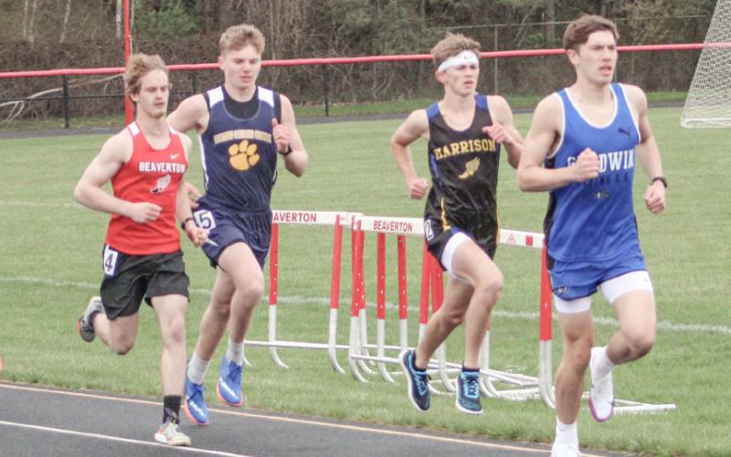 Gladwin’s Ben Verellen and Beaverton’s Eric Larson race in the 1600 meters last week at Beaverton.