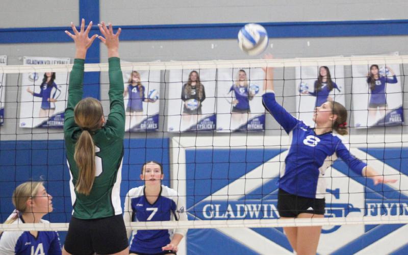 Gladwin’s Maddie Pagel goes up for a kill during last Wednesday’s three-set victory over visiting Clare.