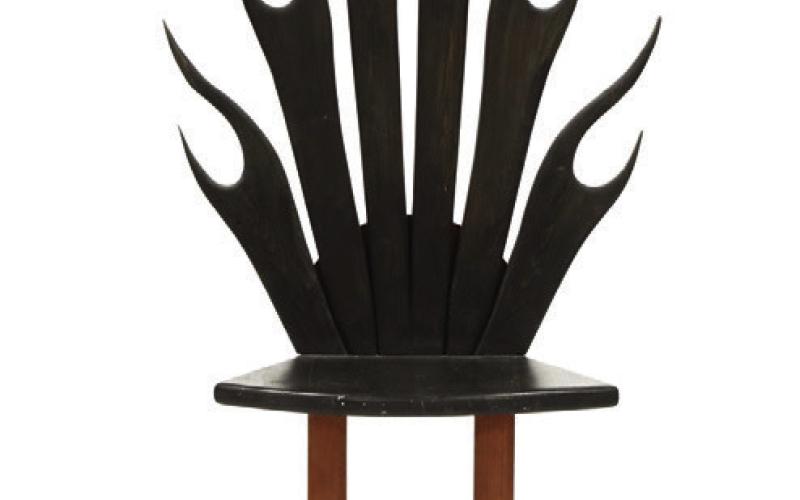 Stylized shapes, light wood, bold blocks of color and unusual construction are characteristics of modern furniture. This flame rocking chair shows all four. KOVELS.COM