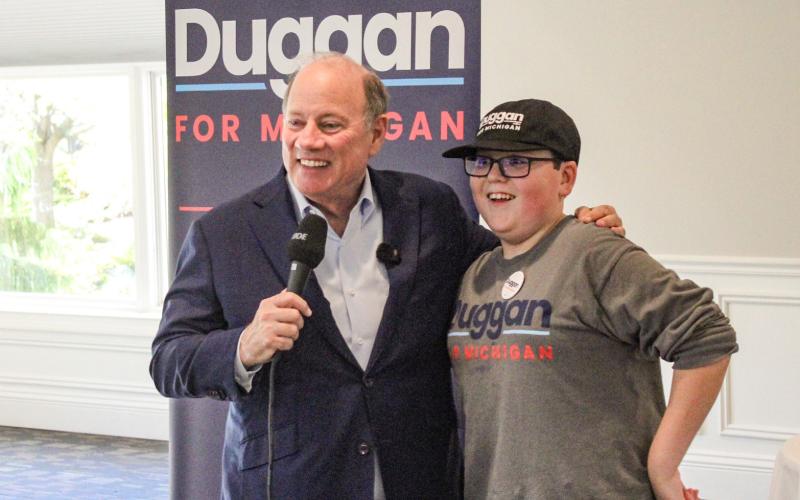 Candidate for Governor Mike Duggan and one of his biggest local supporters, Beaverton Junior High School student Tanner Oard, meet the people at a rally at Riverwalk Grill Saturday.