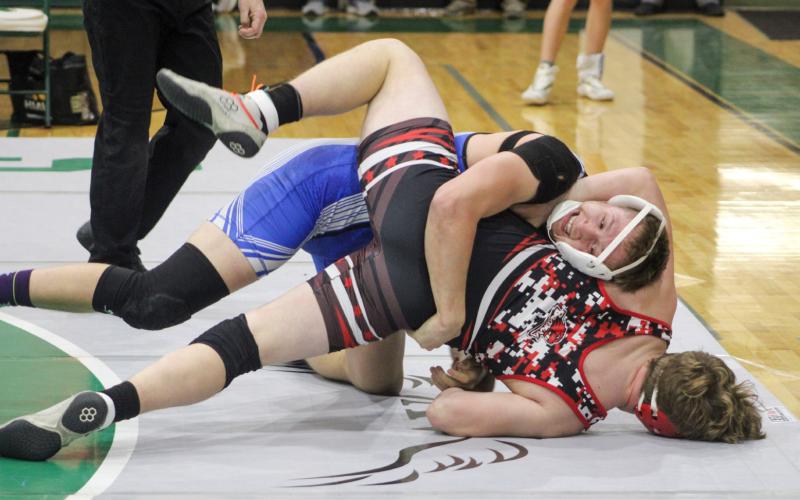 Gladwin’s Braden Ritchie puts the pressure on Beaverton’s Justin Wood. Ritchie was First Team All-Conference at 190 and Wood was Second Team.