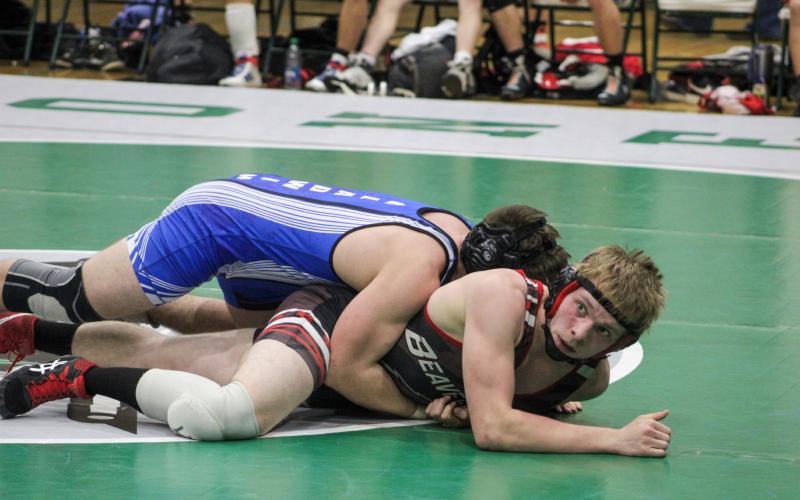 Gladwin First Team All-Conference selection Gaven Evans-Ferguson gets a grip on Beaverton Honorable Mention honoree Ian Krezenski at 165.