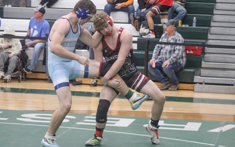 Beaverton Second Team All-Conference honoree Justin Wood gets a leg up on a Meridian opponent at the league meet at 190.