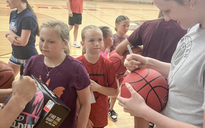 All-State selection Taryn Roberts signs autographs at Beaverton’s basketball camp for grade schoolers last week.