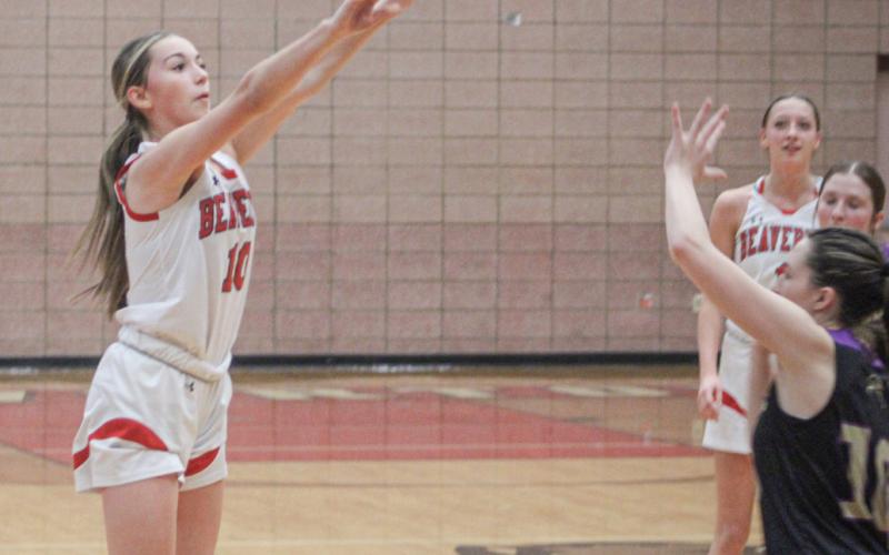 Beaverton’s Harper Pollard launches a 3-pointer that went in off the glass at the buzzer ending the first half of Friday night’s win over Farwell.