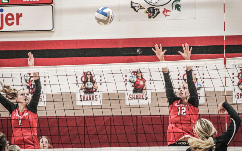 Braylin Orton and Trinity Danielak defend the net during a recent match. The Beavers snapped a three-game losing streak with a win last Wednesday.