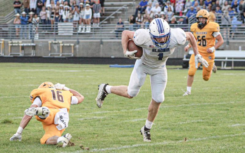 Trace Corlew breaks a tackle during Gladwin’s first meeting with Ogemaw Heights this season. Corlew had a touchdown and a two-point conversion Saturday in a first-round playoff victory at Kingsford.