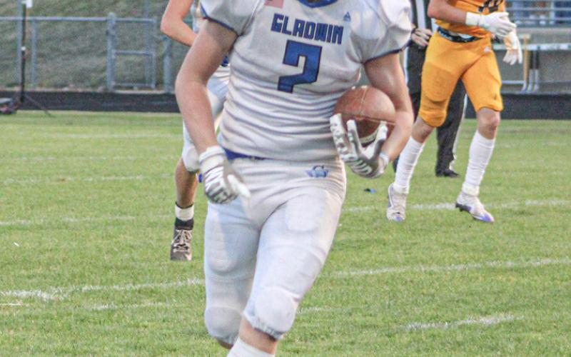 Bronson Bigham heads right and then cuts at Ogemaw Heights earlier this season. The freshman made a great catch to put Gladwin in position to kick the game-winning field goal Saturday at Kingsford.