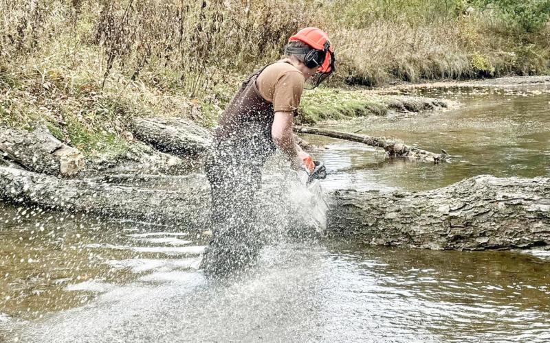 Clearing fallen trees from the Cedar River.
