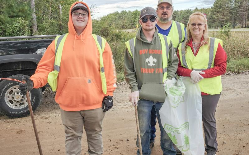 Highway clean up: Riley Banfield, Dylan Moore, Brian Sharpsteen (in back) and Chrissy Sharpsteen.