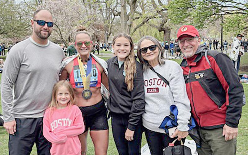 After Kim Kaleto finished the Boston Marathon for the second time last Monday, she posed for a photo with her family (left to right) husband, Jeff, daughter, Paige, daughter, Lily, mom, Bridget, and step dad, Brian.