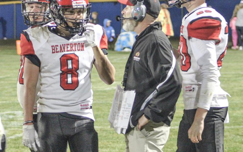Beaverton coach Aaron Seiser talks things over with his players during a time out. The Beavers will host St. Louis Friday night.