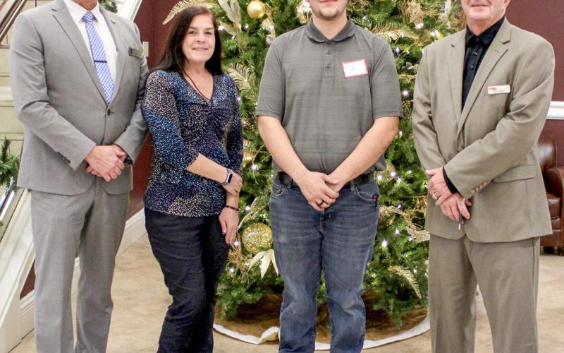 Pictured left to right are State Representative Mike Hoadley, Gladwin County Commissioner Karen Moore, Jason Ash, and Michigan Works! Region 7B Executive Director Mark L. Berdan.