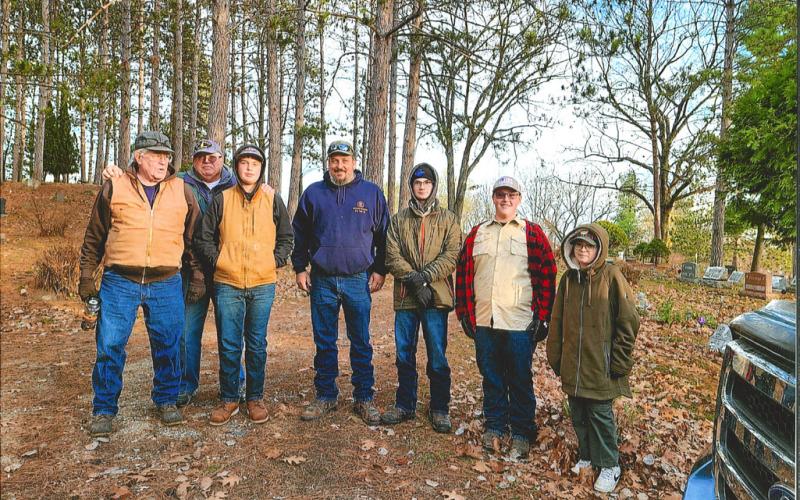 On Saturday, November 12, this group of American Legion Post 171 members, Boy Scouts of America Troop 779 and Cub Scout Pack 3779 set out to recover flags from the Highland Cemetary before the winter weather sets in. Photographed from left to right: Martin Looker, Mike Perry, Hunter Davy, Brian Sharpsteen, Dylan Moore, Riley Banfield, Bradley Klein. Not pictured: Chrissy Sharpsteen.