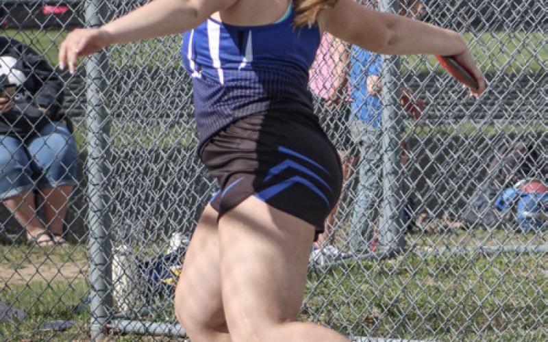 Gladwin’s Chloe Lawrason competes in the discus at the Legends Meet.