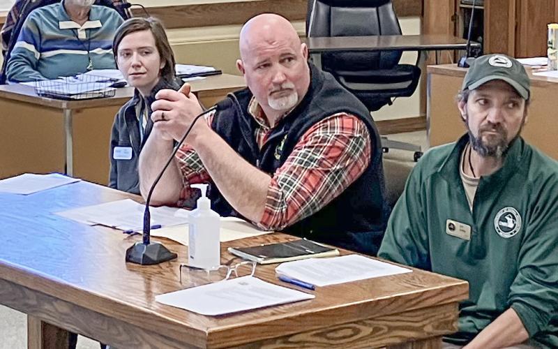 Doug Schultz, at center, of the DNR Fisheries Division is one of several state officials working with Save Trout Lake!