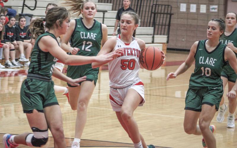 Beaverton’s Myah Hubble fights through the crowd on her way to the basket during last week’s victory over visiting Clare.