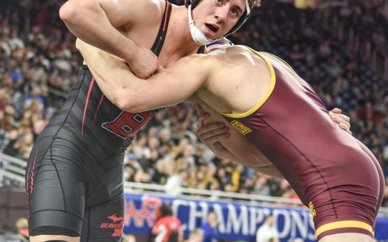 Beaverton’s Eli Roe checks the clock during the Division 4 state championship match at 175 Saturday at Ford Field. PHOTO COURTESY OF HIGH SCHOOL SPORTS SCENE