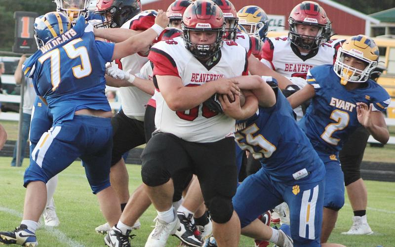 Beaverton big man Leland Love barrels through the line for a two-point conversion during Friday night’s season-opening victory at Evart.