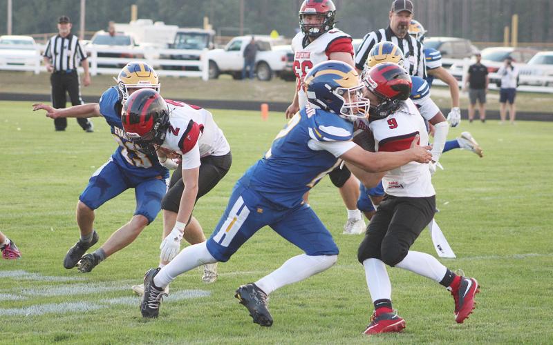 Beaverton used a strong ground game to attack Evart in Friday’s win, but not all of the runs ended pleasantly, as ball-carrier Colton Miller can attest.