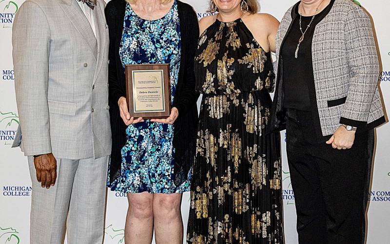 Pictured left to right: Dr. L. Marshall Washington, MCCA Board Chair; Dr. Debra Daniels, 2026 Outstanding Alumnus Award recipient; Brandy Johnson, President of MCCA; and Dr. Michelle Allmendinger, President of Delta College.