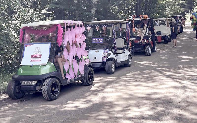 Wiggins Lake holds Golf Cart and Boat Parades