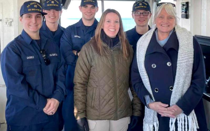 Lori Fassett and Tammy Alvaro are pictured with Biscayne Bay crew members during the event.