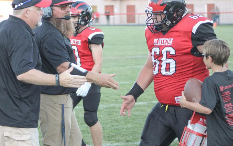 Beaverton’s Leland Love gets a rousing welcome back to the sidelines. The Beavers improved to 2-1 Friday night with a victory over Farwell.