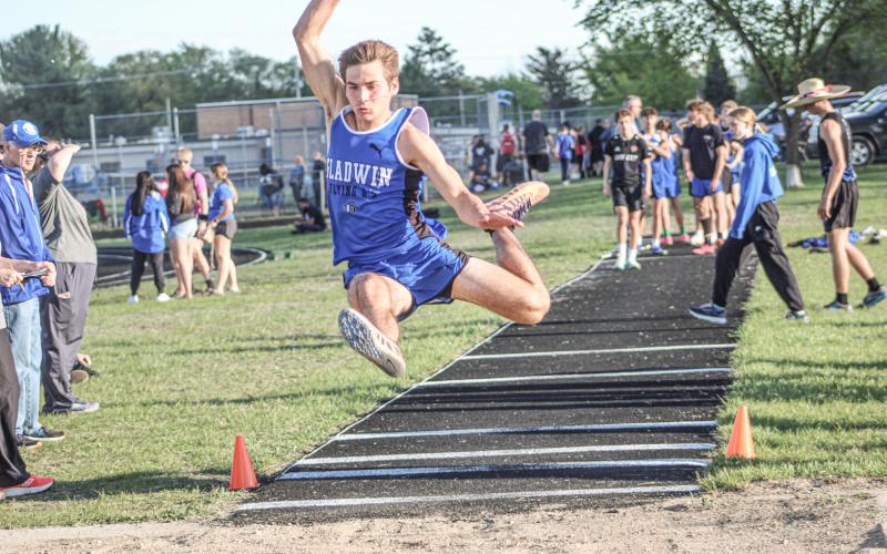 Gladwin’s Drew von Matt soars to a second-place finish in the long jump Friday at the Legends Track Meet.