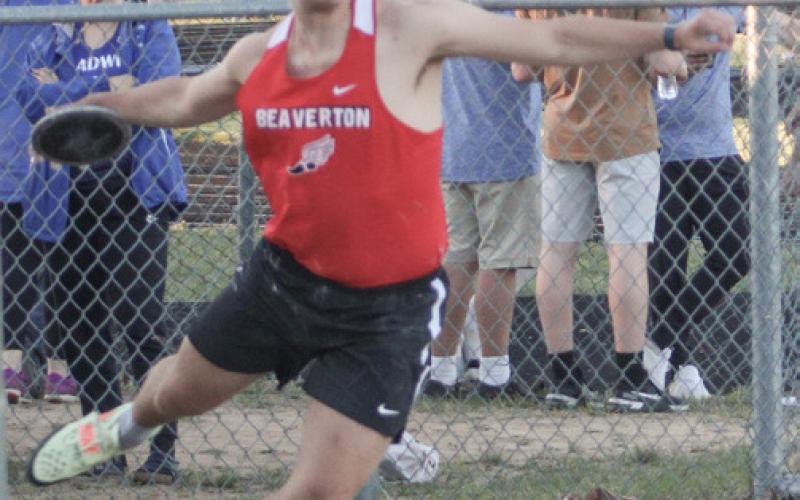 Beaverton’s Mason Ptak throws the discus at the Legends Meet.