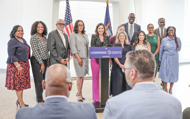 Governor Gretchen Whitmer is pictured announcing recipients of medical debt forgiveness collaborating with Undue Medical Debt.