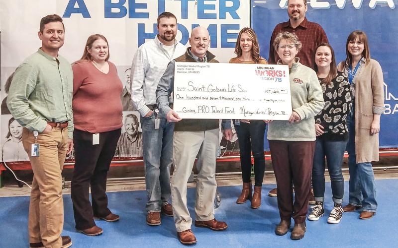 Pictured left to right are Camerin Levi, Jessica Wilder, Ryan Harris, Jon-Paul Jones, Kayla Krahner, Michigan Works! Region 7B Chief Operating Officer Pam O’Laughlin, Ryan Roberts, Jackie Lamont, and Amanda Bootz.